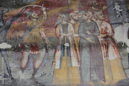 Wall frescoes in Saint Mary's Church of Leusa with its vandalized murals from AD 1812 depicting Bible scenes. Permet-Albania-230