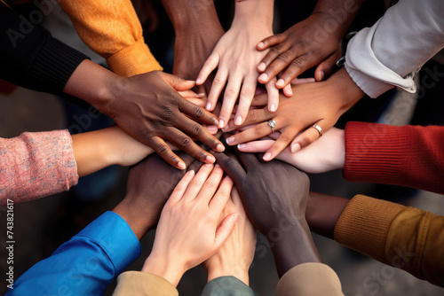 Group of diverse hands joining together  view from above
