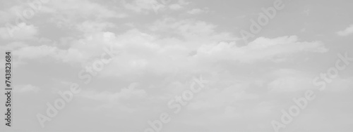 White cloud in the sky. View on a soft white fluffy cloud as background. Cloudy sky, white clouds, black background pattern. The gray cloud trendy photo. White sky image 