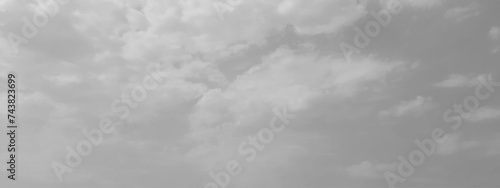 White cloud in the sky. View on a soft white fluffy cloud as background. Cloudy sky, white clouds, black background pattern. The gray cloud trendy photo. White sky image	