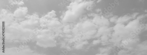 White cloud in the sky. View on a soft white fluffy cloud as background. Cloudy sky, white clouds, black background pattern. The gray cloud trendy photo. White sky image	