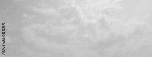 White cloud in the sky. View on a soft white fluffy cloud as background. Cloudy sky, white clouds, black background pattern. The gray cloud trendy photo. White sky image	