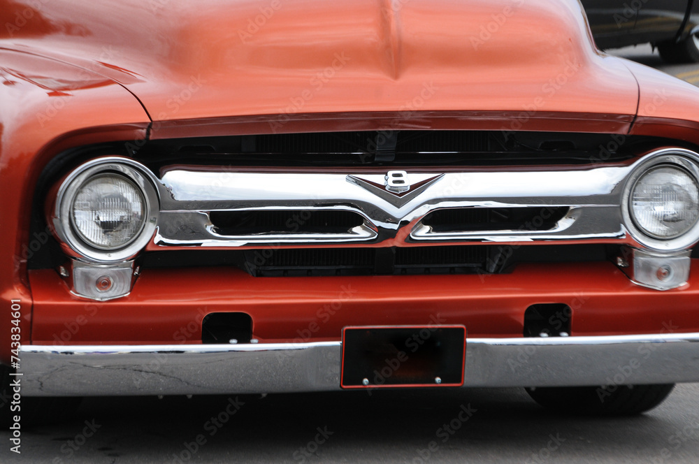 A Close up View Shows The Front End Of A 1950s Ford F 100 Classic a-close-up-view-shows-the-front-end-of-a-1950s-ford-f-100-classic