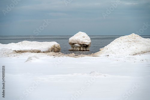 Rocks and ice on the shore of the Baltic Sea, Kaltene, Latvia photo