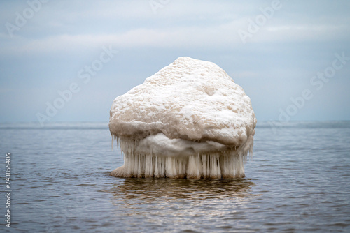 Close-up shot of the Frozen ice blocks in Baltic sea water on the shore, Kaltene, Latvia photo