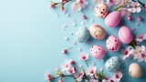 Easter egg with Colorful flower on blue background, copy space