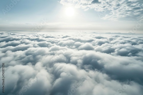 Aerial view of fluffy white clouds from above. peaceful and serene sky perspective