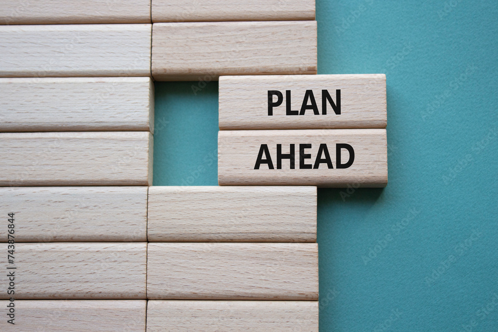 Plan ahead symbol. Wooden blocks with words Plan ahead. Beautiful grey green background. Business and Plan ahead concept. Copy space. Plan ahead symbol. Wooden blocks with words Plan ahead. Beautiful grey green background. Business and Plan ahead concept. Copy space.