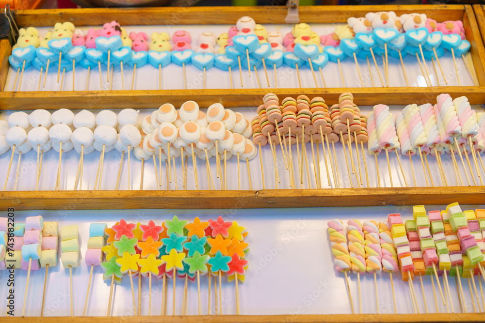 Colorful Candy Skewers at a Market Stall