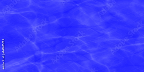 Modern Vivid deep blue water background. Transparent water in pool. Blue water with ripples on the surface. Defocus blurred blue water shining in the sea. rippled water detail background. 