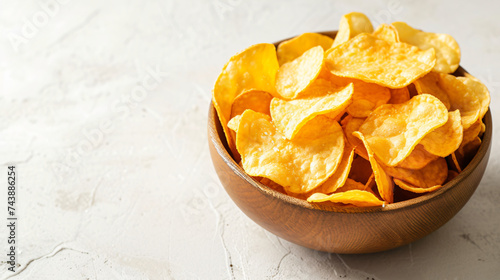 Bowl with salted crunchy potato crisps chips.