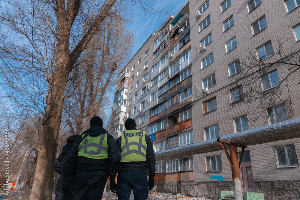 An attack drone (shahed) hit the roof of a house. Rocket attack on a residential building in the city of Dnepr. Consequences after a strong explosion. War in Ukraine and Russia. People under the rubbl