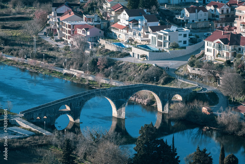 Old bridge over the city in Ottoman style, Perovic/Arslanagic Bridge on the river Trebisnjica, Trebinje, Hercegovina photo