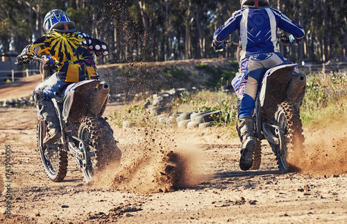 Sport, racer and motorcycle in action for competition on dirt road with performance, challenge and adventure. Travel, motorbike or dirtbike driver with helmet on offroad course or path for racing