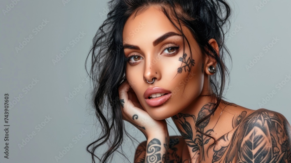 Close up of beautiful tattooed woman on color background, studio shot. Self expression. Close up of beautiful tattooed woman on color background, studio shot. Self expression.