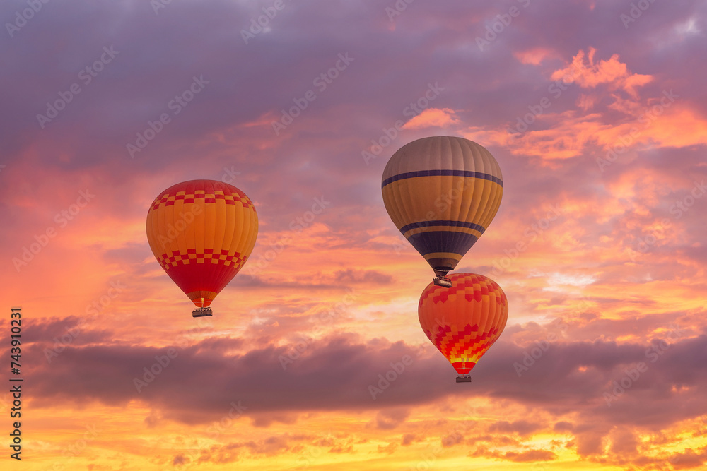 Close up of coloful hot air balloons, scenic pink sky at sunrise Close up of coloful hot air balloons, scenic pink sky at sunrise