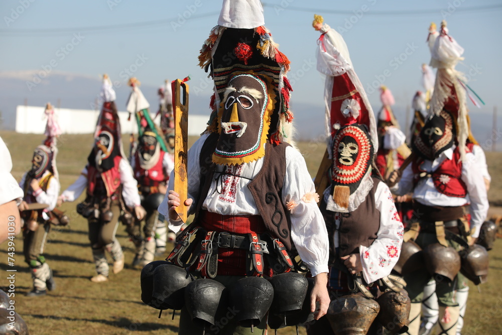 People called Kukeri parade in masks and ritual costumes, perform ritual dances to drive away evil spirits in the town of Elin Pelin, Bulgaria.