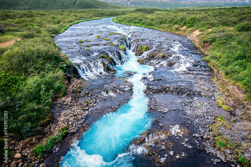 Bruarfoss waterfall flowing from Bruara river on wilderness in summer at Iceland photo