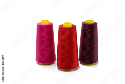 spool with red orange and purple thread for sewing machine
