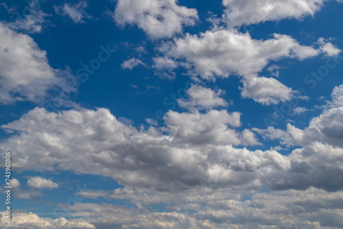 Beautiful blue sky with white Altocumulus undulatus clouds.
