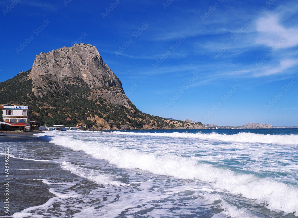 Beautiful landscape seacost with rocks at the sunny day new world long exposure