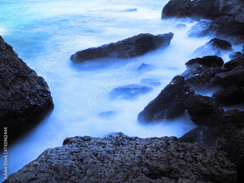 Beautiful landscape seacost with rocks at the sunny day new world long exposure