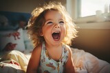 Happy baby girl portrait on bed, smiling toddler naptime, joyful infant relaxing in bedroom