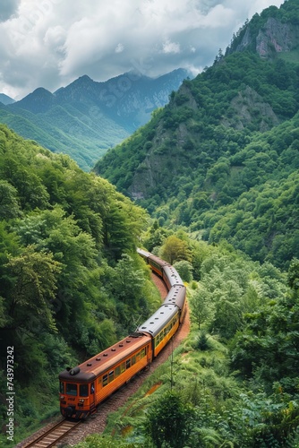 A passenger train winding through a mountainous landscape