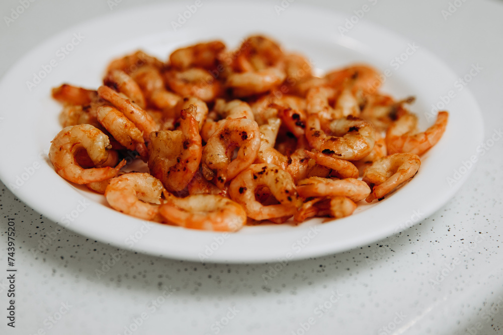 Delicious shrimp and mussels. Seafood on a white plate Delicious shrimp and mussels. Seafood on a white plate