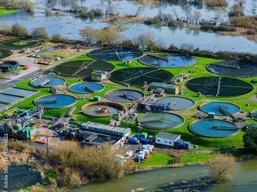 Medium telephoto aerial shot of sewerage treatment plant near Salisbury, UK
