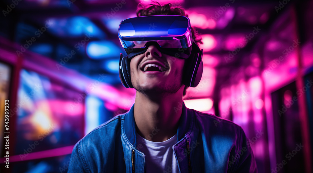 Young man wearing VR glasses on a futuristic background Young man wearing VR glasses on a futuristic background