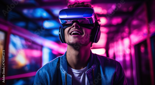 Young man wearing VR glasses on a futuristic background © sonatik