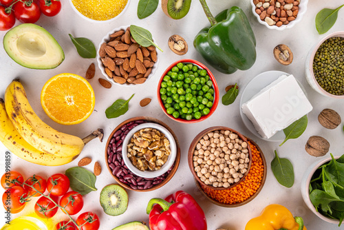 Portfolio Diet, balanced lowering cholesterol vegan food, including nuts, vegetable protein, plant sterols, viscous fiber, beans, legumes, fresh vegetables and fruits on white background copy space photo