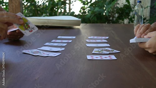 Two people playing the matching game with cards