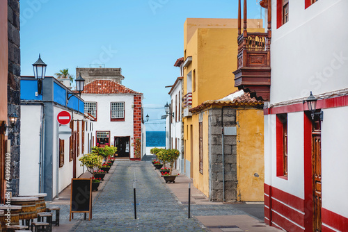 a colorful picturesque street of a seaside town. colorful houses in a small town. Garachico. Tenerife photo