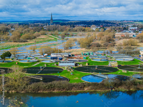 Aerial shot of Sewerage farm, flooded River Avon and Salisbury Cathedral in background