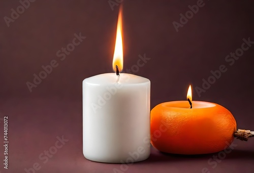  White paraffin candle with a flame burning
