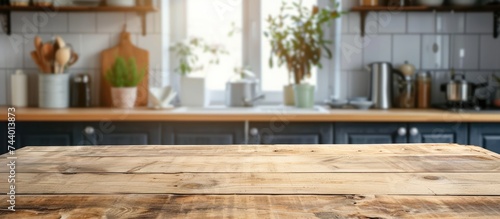 A photo showcasing a wooden table top in a kitchen, positioned beside a window, providing a view of the surrounding space.