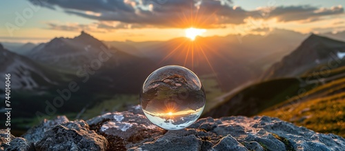 round crystal ball on a mountain rock photo