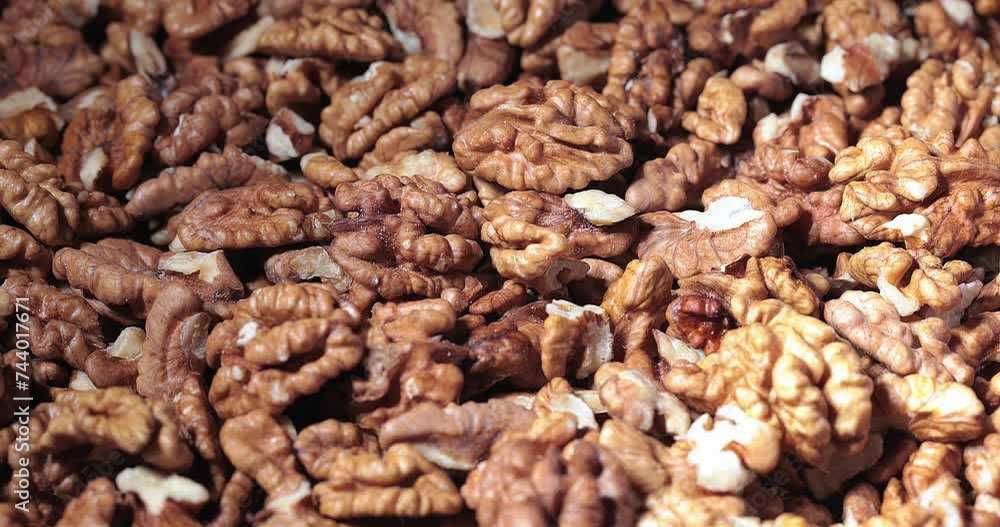 Walnut close up.product with minerals and vitamins, walnut turns in a table Walnut close up.product with minerals and vitamins, walnut turns in a table