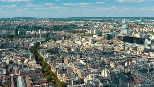 Wallpaper Mural PARIS, FRANCE - MAY 30, 2023: Panorama aerial view of Paris city historical center. Top drone view of old and modern famous touristic landmarks. Colorful sky at at sunny day. Torontodigital.ca