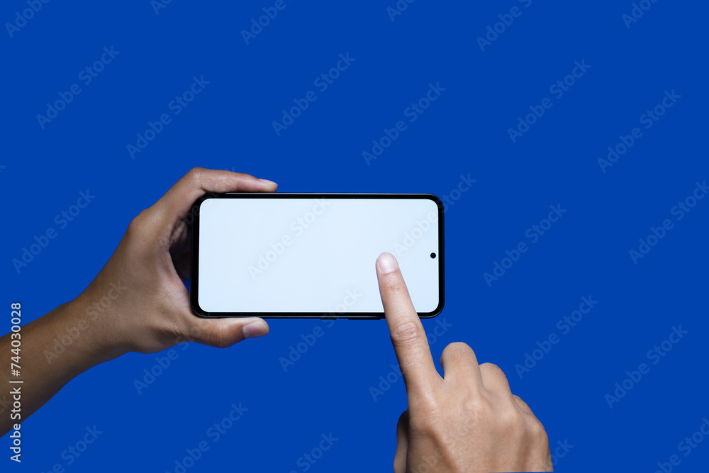 Hand holding a black smartphone with a white screen. with copy space. Designing a frameless smartphone application Hand holding a black smartphone with a white screen. with copy space. Designing a frameless smartphone application