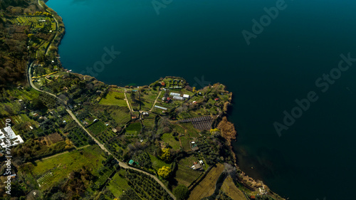 Aerial view of Lake Nemi. It is a small circular volcanic lake in the Alban Hills, near Rome in the Lazio region of Italy. It was formed in an ancient volcanic crater. photo