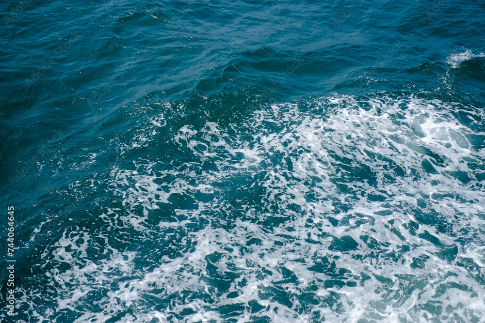 Blue coloured sea surface, colourful background image of ocean 