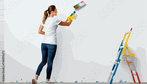 Una mujer pintando una pared