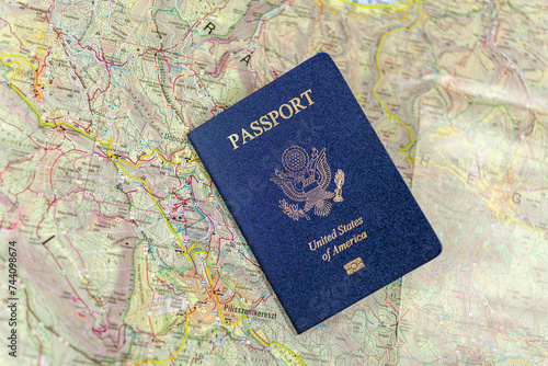 United States passport on a paper map.