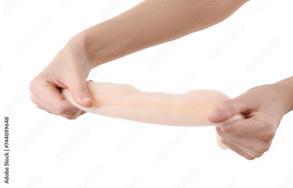 Woman holding beige felting wool on white background, closeup Woman holding beige felting wool on white background, closeup