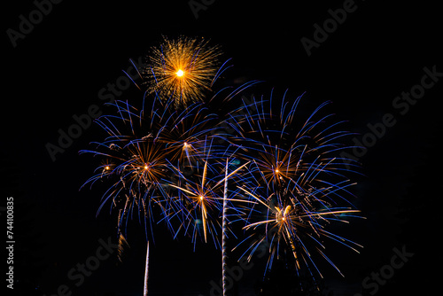 Montreal  Canada - June 25 2022  Fire works show with quarter moon in background at La Ronde in Montreal