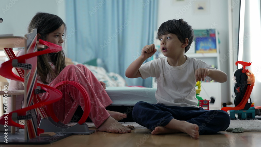 Siblings Enjoying Playtime with Toy Parking Lot in Bedroom, Brother and Sister Sharing Fun Moment Siblings Enjoying Playtime with Toy Parking Lot in Bedroom, Brother and Sister Sharing Fun Moment
