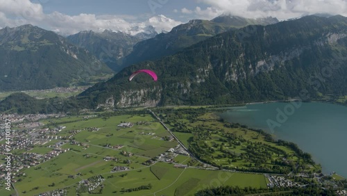 Flying over Switzerland with paraglider - majestic drone shot